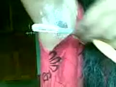 An unidentified bitch with raven hair shaves her unkempt underarms.
